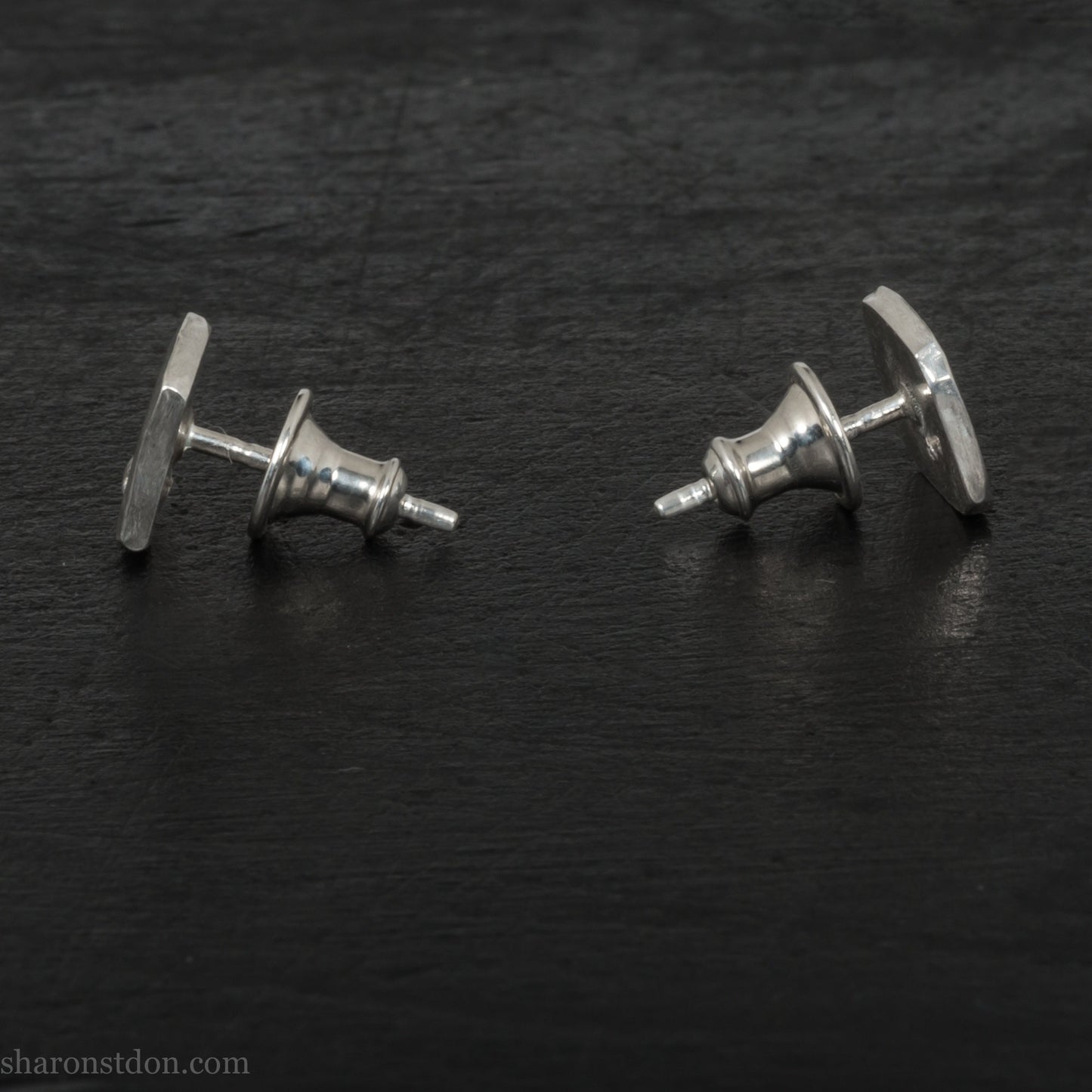 7mm square 925 sterling silver stud earrings with a 2 millimeter Canadian diamond gemstone in the corner. Hammered texture with a matte, shiny finish. Handmade by Sharon SaintDon in North America.