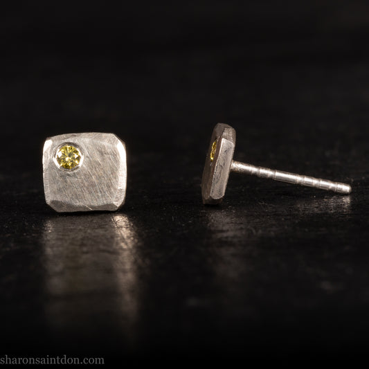Handmade hammered solid 925 sterling silver stud earrings. 7mm square. matte finish with 2mm round canary yellow diamond set in the corner.