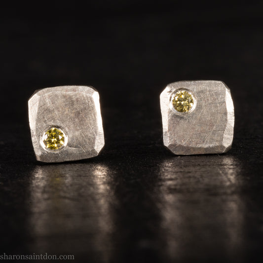 Handmade hammered solid 925 sterling silver stud earrings. 7mm square. matte finish with 2mm round canary yellow diamond set in the corner.