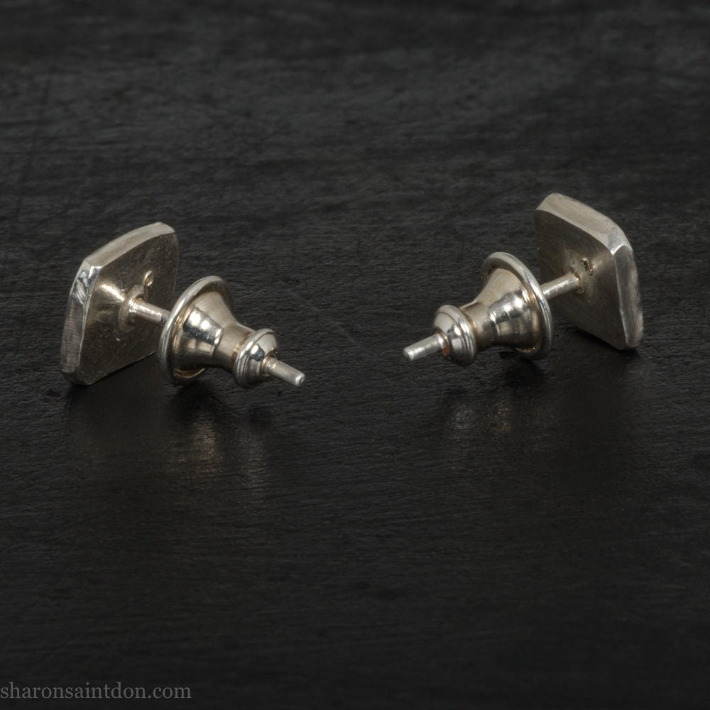 925 sterling silver square stud earrings with lab grown golden yellow topaz gemstones. 925 sterling silver handmade by Sharon SaintDon in North America. 7mm x 7mm, 1.5 thick with 2mm round flush set stone in corner. Silver posts and backs.