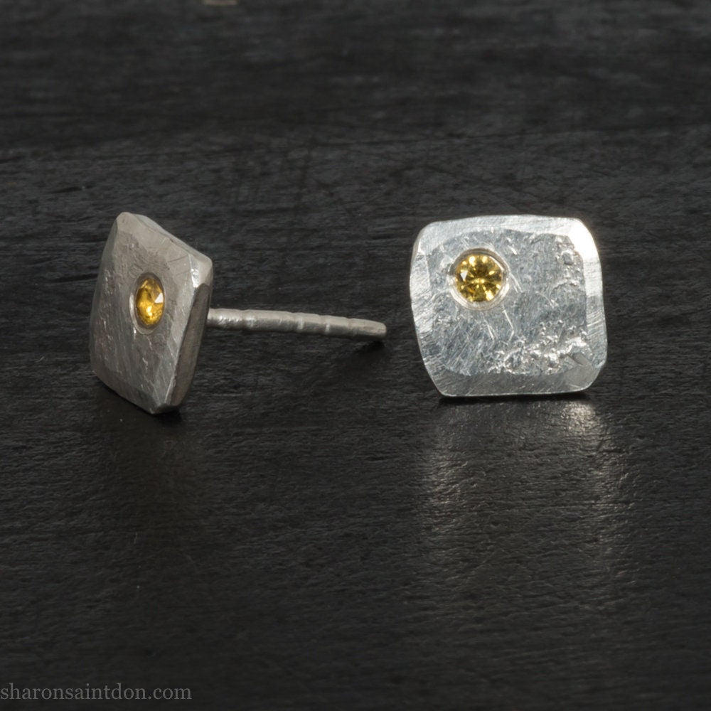 925 sterling silver square stud earrings with lab grown golden yellow topaz gemstones. 925 sterling silver handmade by Sharon SaintDon in North America. 7mm x 7mm, 1.5 thick with 2mm round flush set stone in corner. Silver posts and backs.