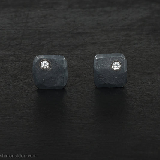 Hammered solid silver and gemstone stud earrings with a 2mm cubic zirconia set in the corner. 7 x 7mm square x 1.5mm thick silver with an oxidized black finish. Solid silver posts and backs. Handmade by Sharon SaintDon in North America.