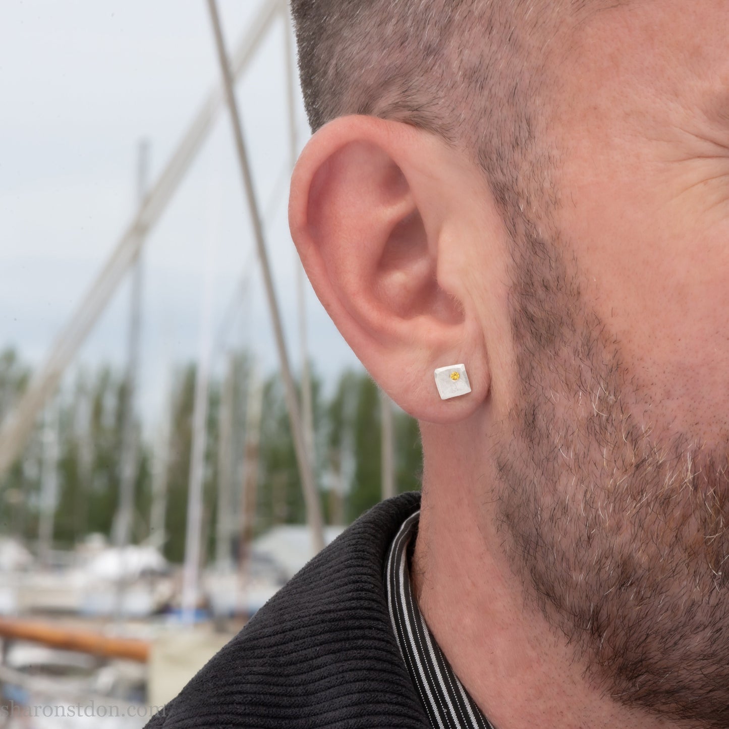 925 sterling silver square stud earrings with lab grown golden yellow topaz gemstones. 925 sterling silver handmade by Sharon SaintDon in North America. 7mm x 7mm, 1.5 thick with 2mm round flush set stone in corner. Silver posts and backs.