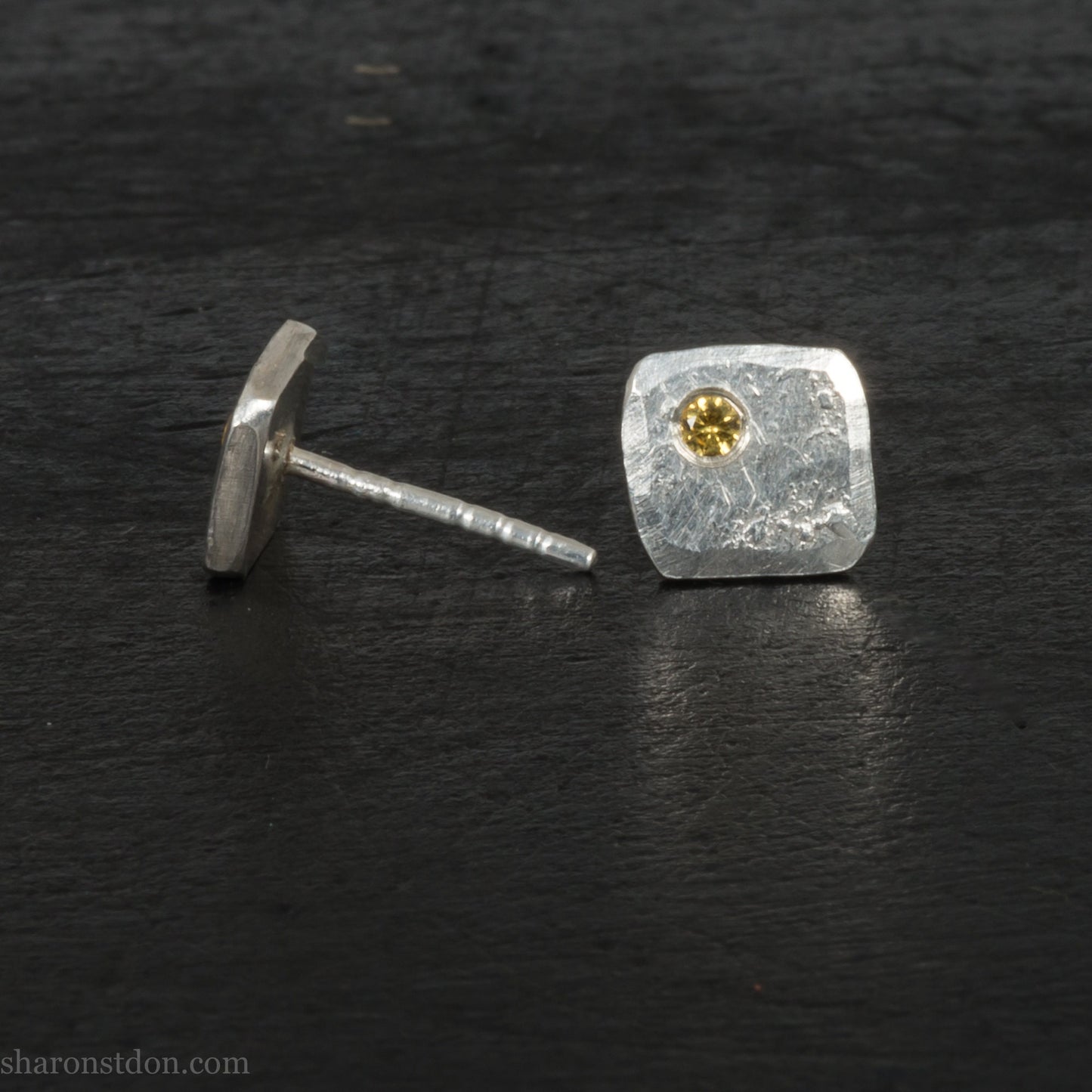 925 sterling silver stud earrings with golden yellow topaz gemstone set in the corner. Small hammered square 7x 7mm and 1.5mm thick, solid sterling silver posts and backs. Handmade by Sharon SaintDon in North America.