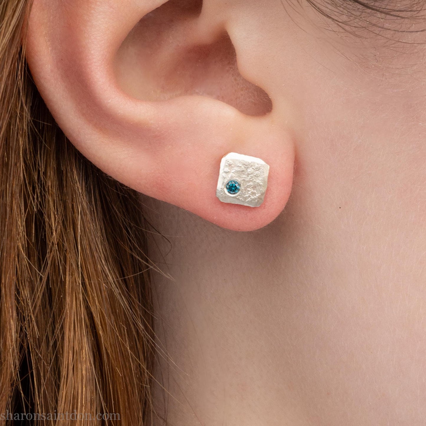 Teal blue diamond gemstone stud earrings. Solid 925 sterling silver, 7mm square with a 2mm round diamond flush set in the corner. Handmade by Sharon SaintDon in North America.