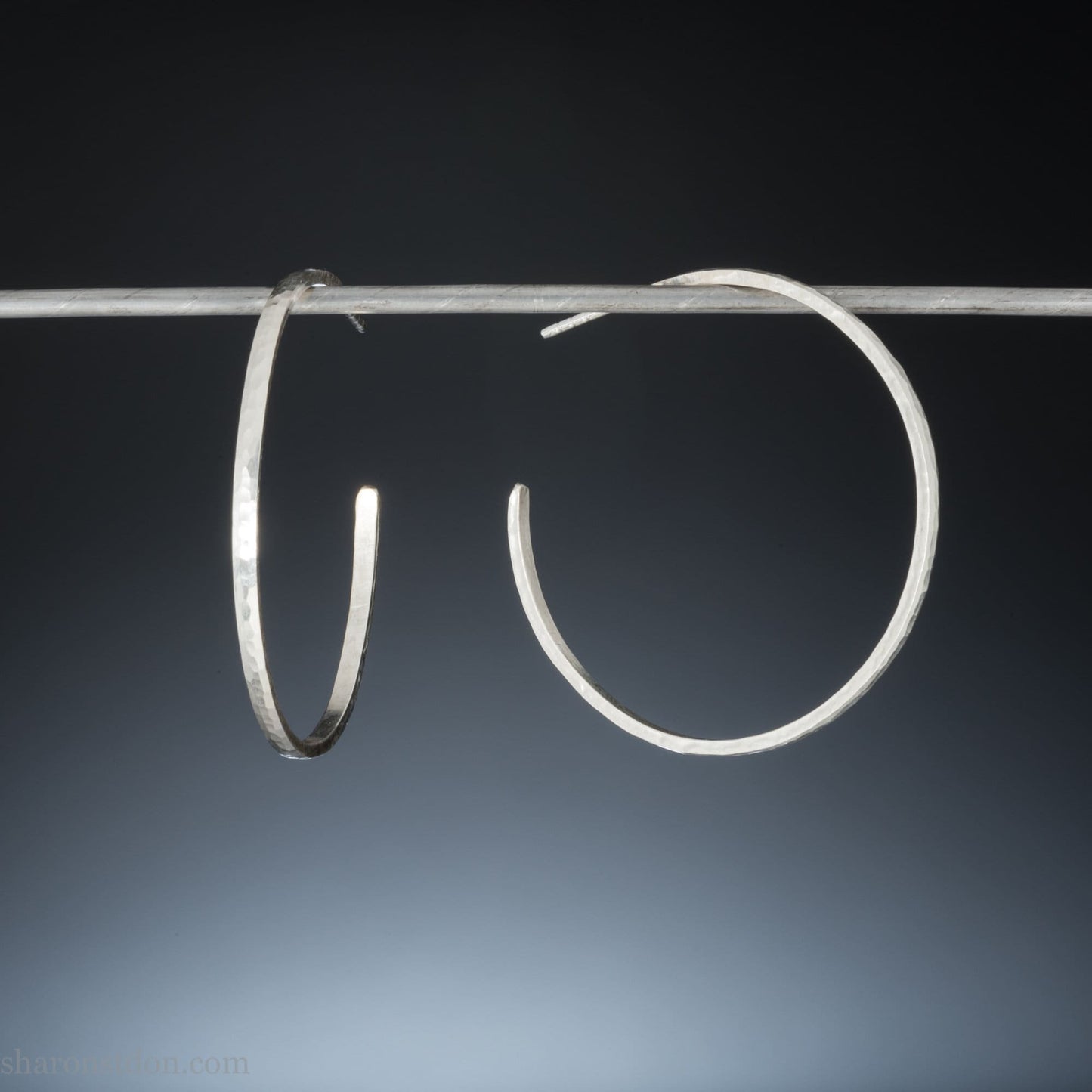 Solid 925 sterling silver hoop earrings. Handmade by Sharon SaintDon in North America. 40mm diameter, 2mm wide, 1.5mm thick, Brushed, matte finish and silver posts and backs.