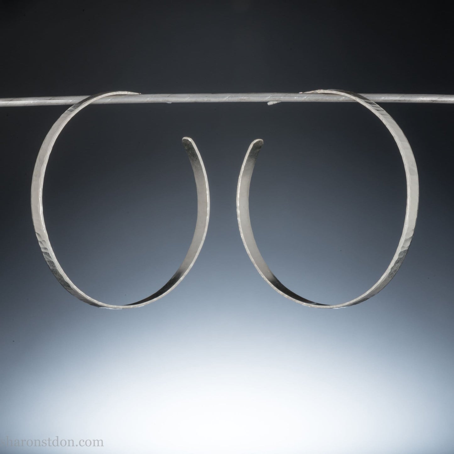 Solid 925 sterling silver hoop earrings. Handmade by Sharon SaintDon in North America. 40mm diameter, 2mm wide, 1.5mm thick, Brushed, matte finish and silver posts and backs.