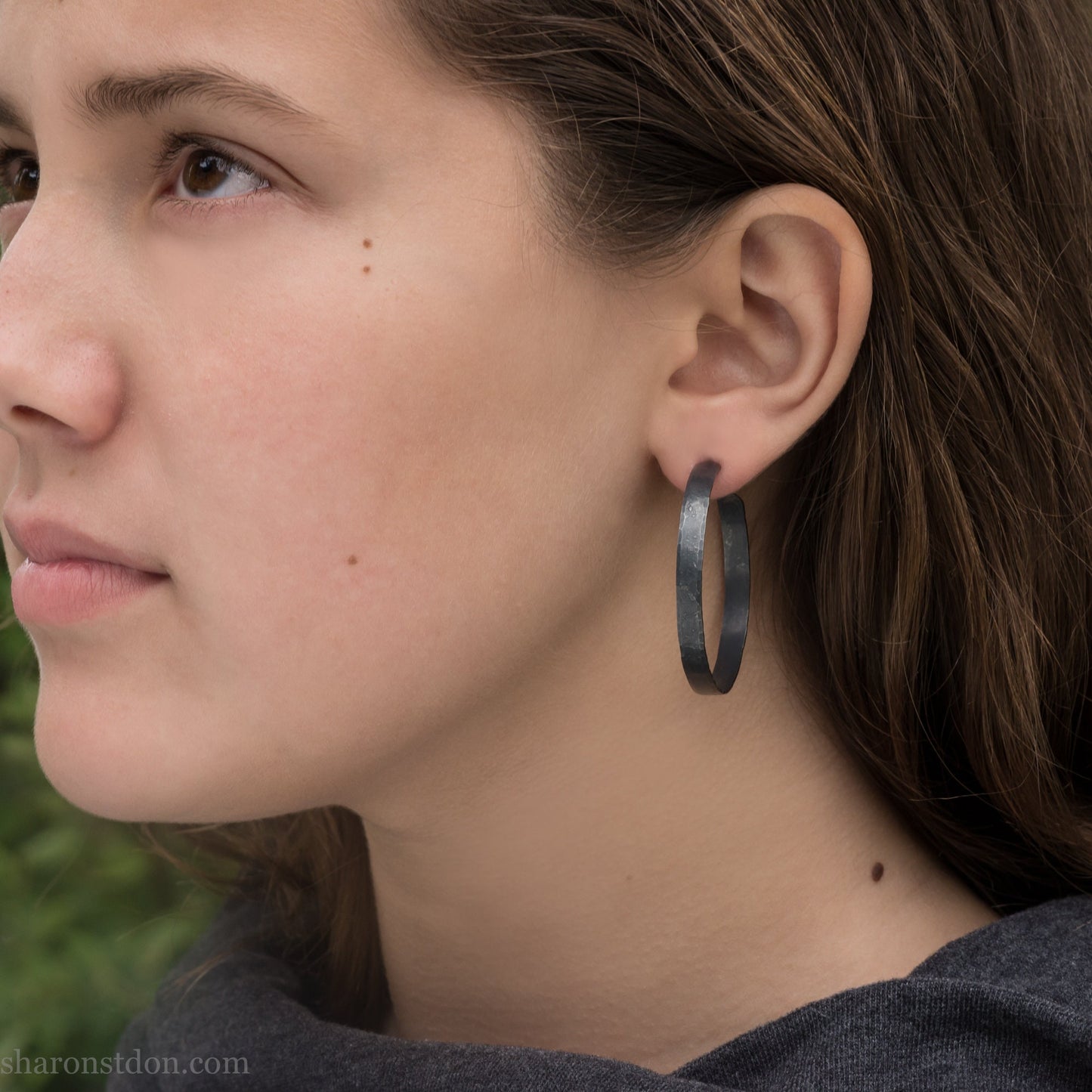 925 sterling silver hoop earrings for women. Hammered, solid silver, oxidized black with silver posts and backs. 40mm diameter, 5mm wide, .75mm thick, comfortable, lightweight. Handmade by Sharon SaintDon in Pacific Northwest, North America.