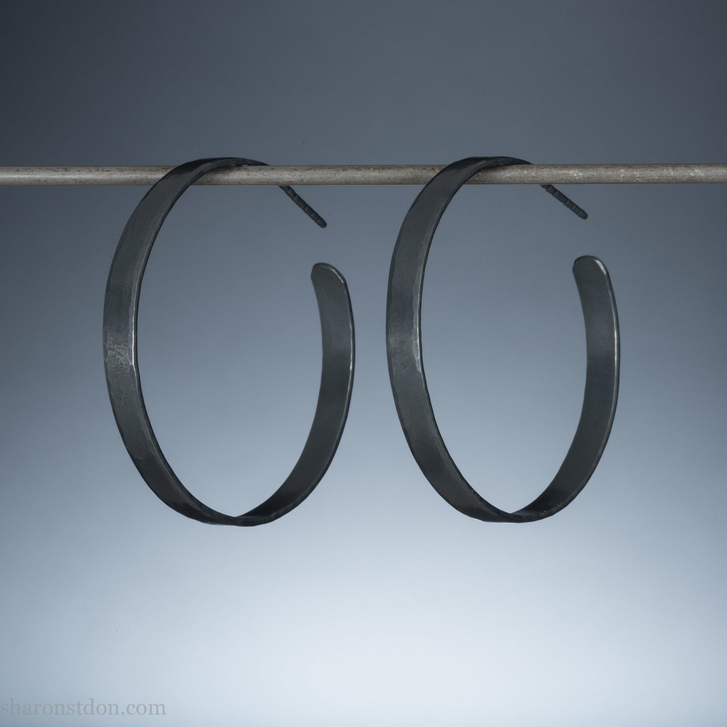 Solid 925 sterling silver hoop earrings handmade by Sharon SaintDon in the USA. 40mm diameter, 5mm wide, Matte shiny finish, hammered wavy texture, sterling silver posts and backs.