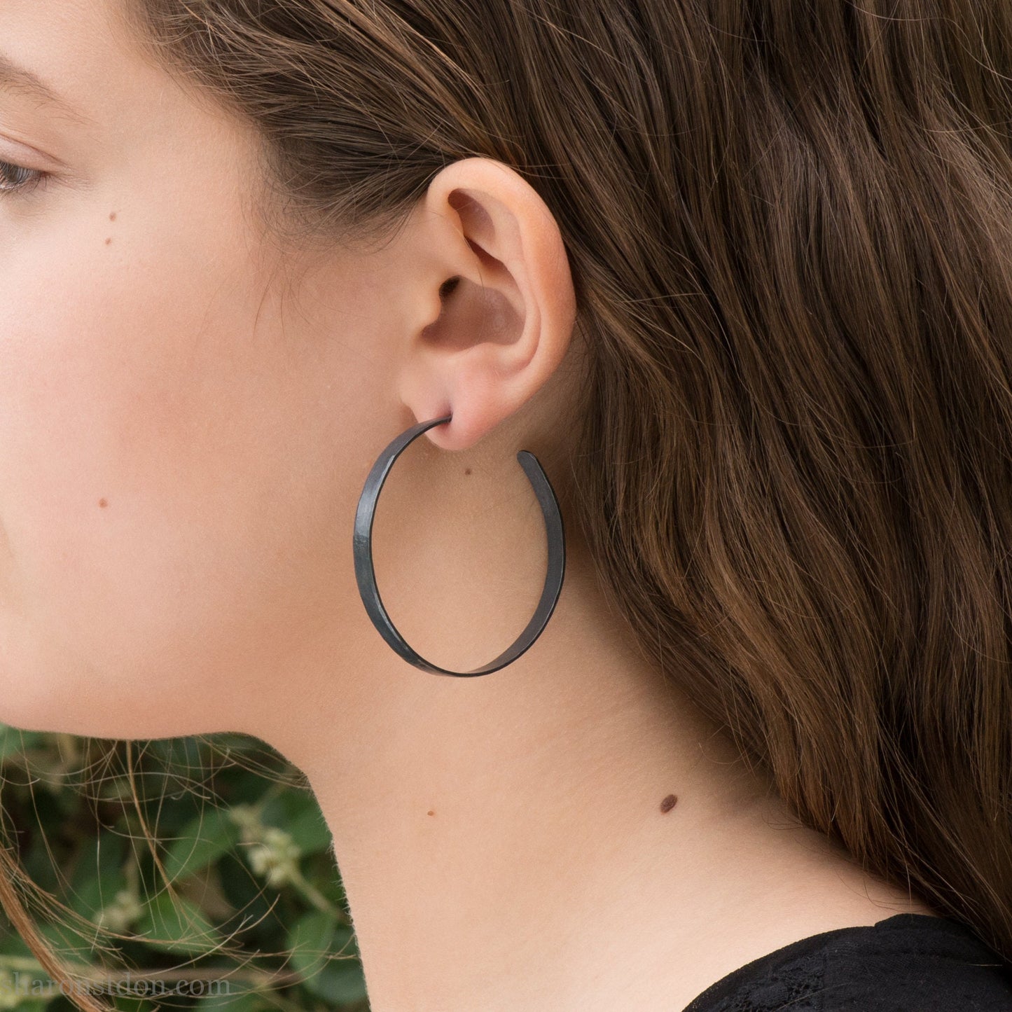 Solid 925 sterling silver hoop earrings. 50mm diameter, 5mm wide, .75mm thick. Oxidized black, charcoal grey, matte finish with silver posts and backs. lightweight, high quality, handmade by Sharon SaintDon in the Pacific Northwest of the USA.