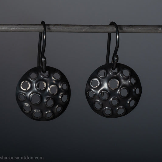 15mm solid 925 sterling silver round disc earrings, hand-punched pattern, flat matte black oxidized finish, French hooks.