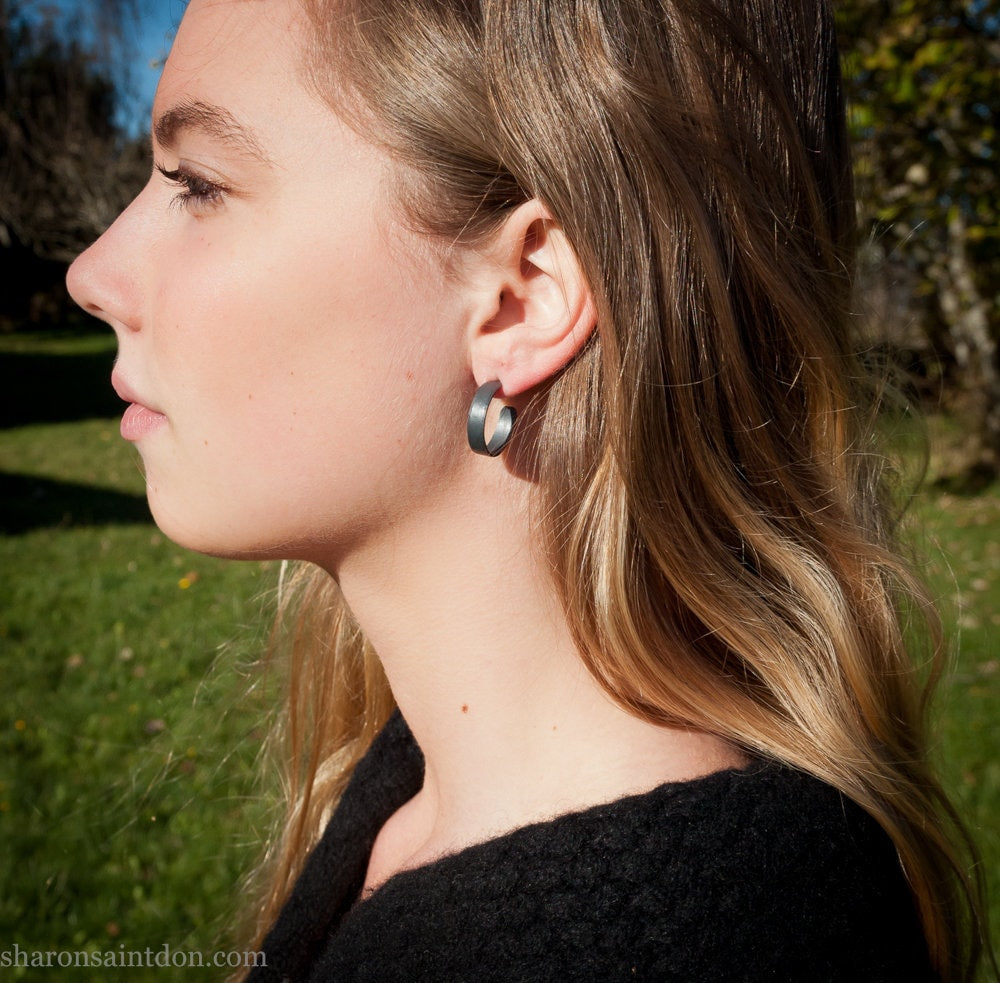 18mm x 4mm oxidized black 925 sterling silver hoop earrings, handmade in North America by Sharon SaintDon for men or women.