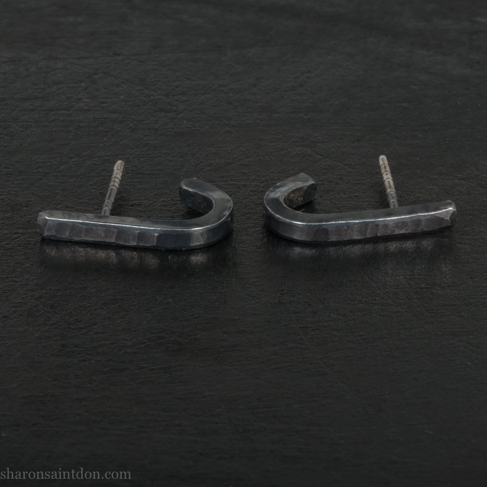 Handmade 925 sterling silver earrings. J wrap, huggie, hammered texture, minimalist, oxidized black earrings made by Sharon SaintDon in North America.