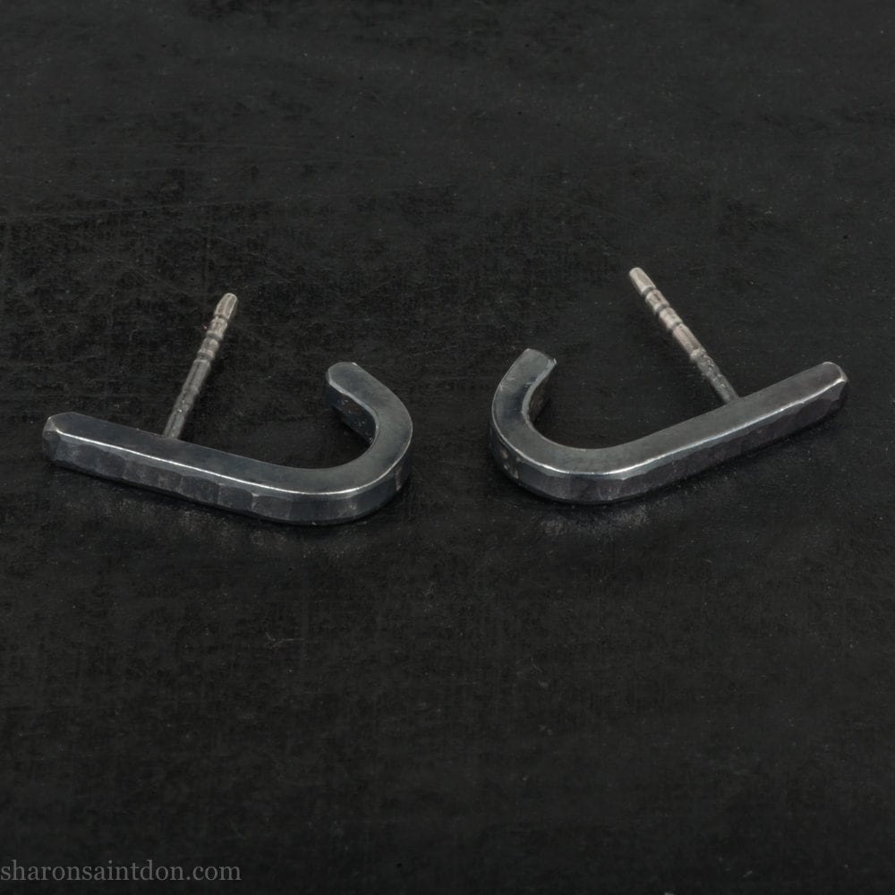 Handmade 925 sterling silver earrings. J wrap, huggie, hammered texture, minimalist, oxidized black earrings made by Sharon SaintDon in North America.