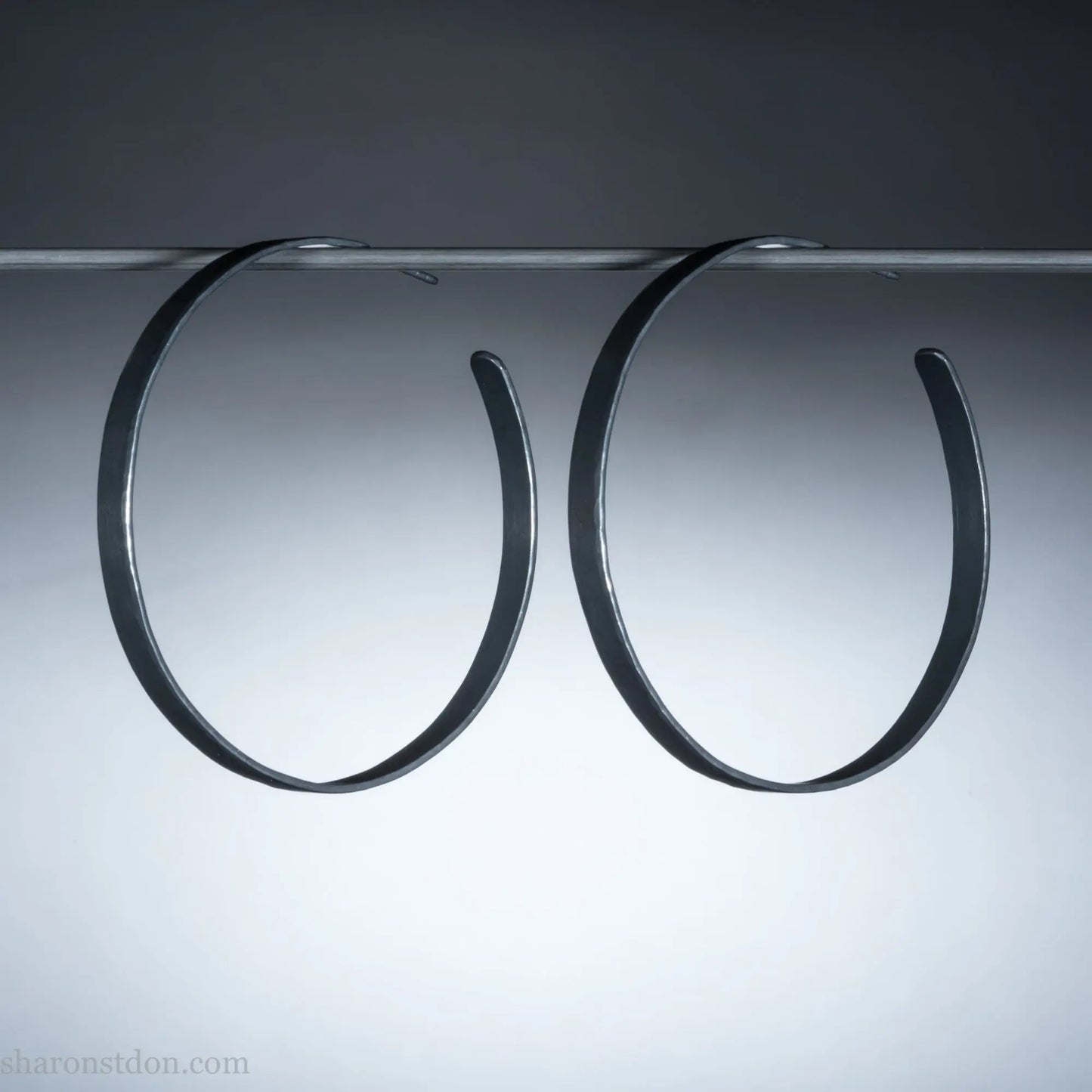 Handmade 925 sterling silver hoop earrings for women. 55mm diameter, 5mm wide, Oxidized black, large hoops for daily wear. Minimalist, comfortable, lightweight with a hammered, texture.