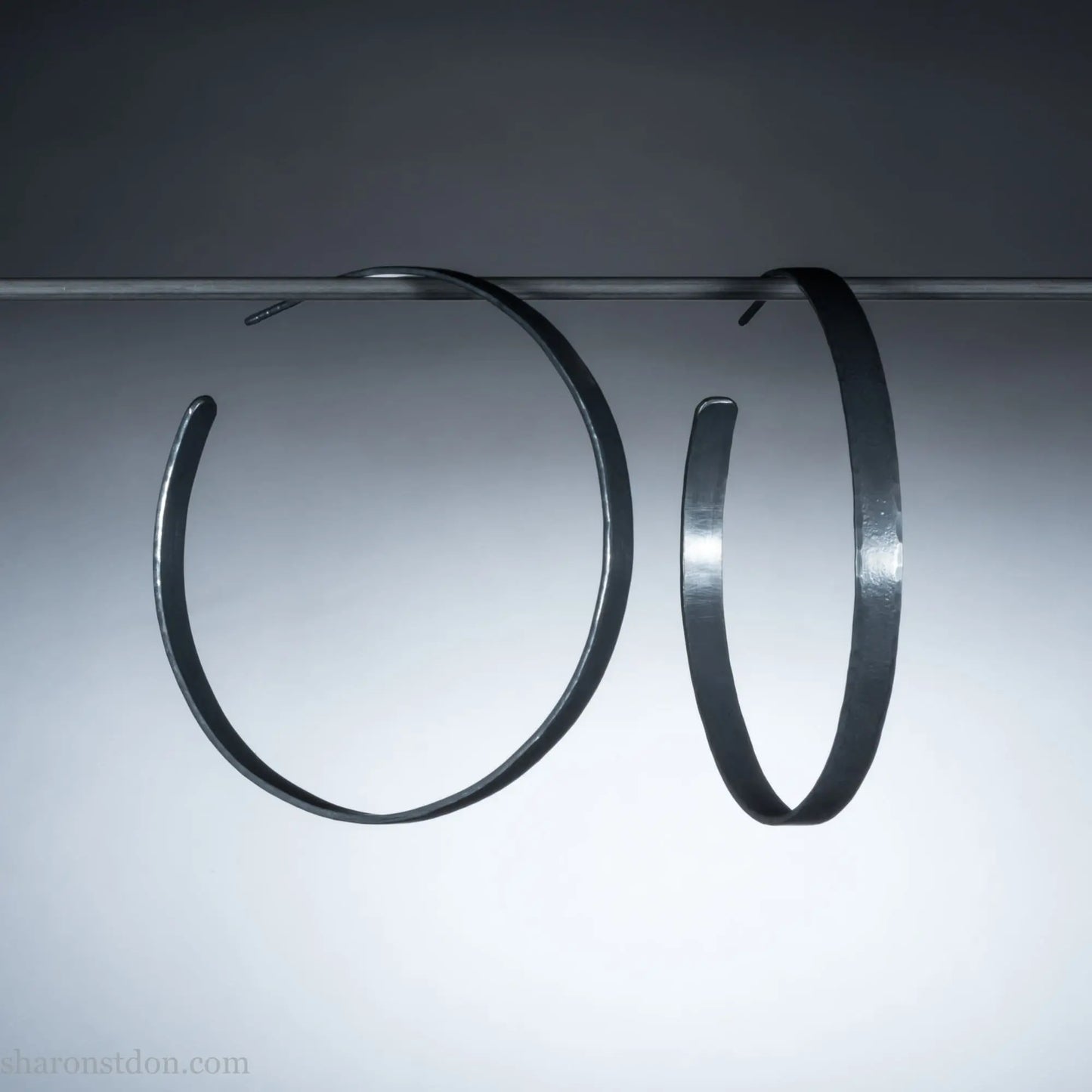 Handmade 925 sterling silver hoop earrings for women. 55mm diameter, 5mm wide, Oxidized black, large hoops for daily wear. Minimalist, comfortable, lightweight with a hammered, texture.