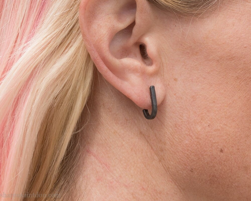 Handmade 925 sterling silver earrings. J wrap, huggie, hammered texture, minimalist, oxidized black earrings made by Sharon SaintDon in North America.