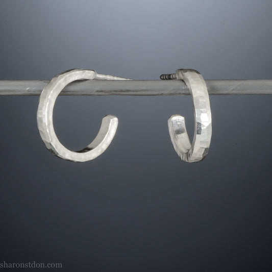14mm x 2mm small sterling silver hoop earrings, Handmade in North America by Sharon SaintDon. Hammered texture, solid silver with silver posts and backs for men or women, unisex.