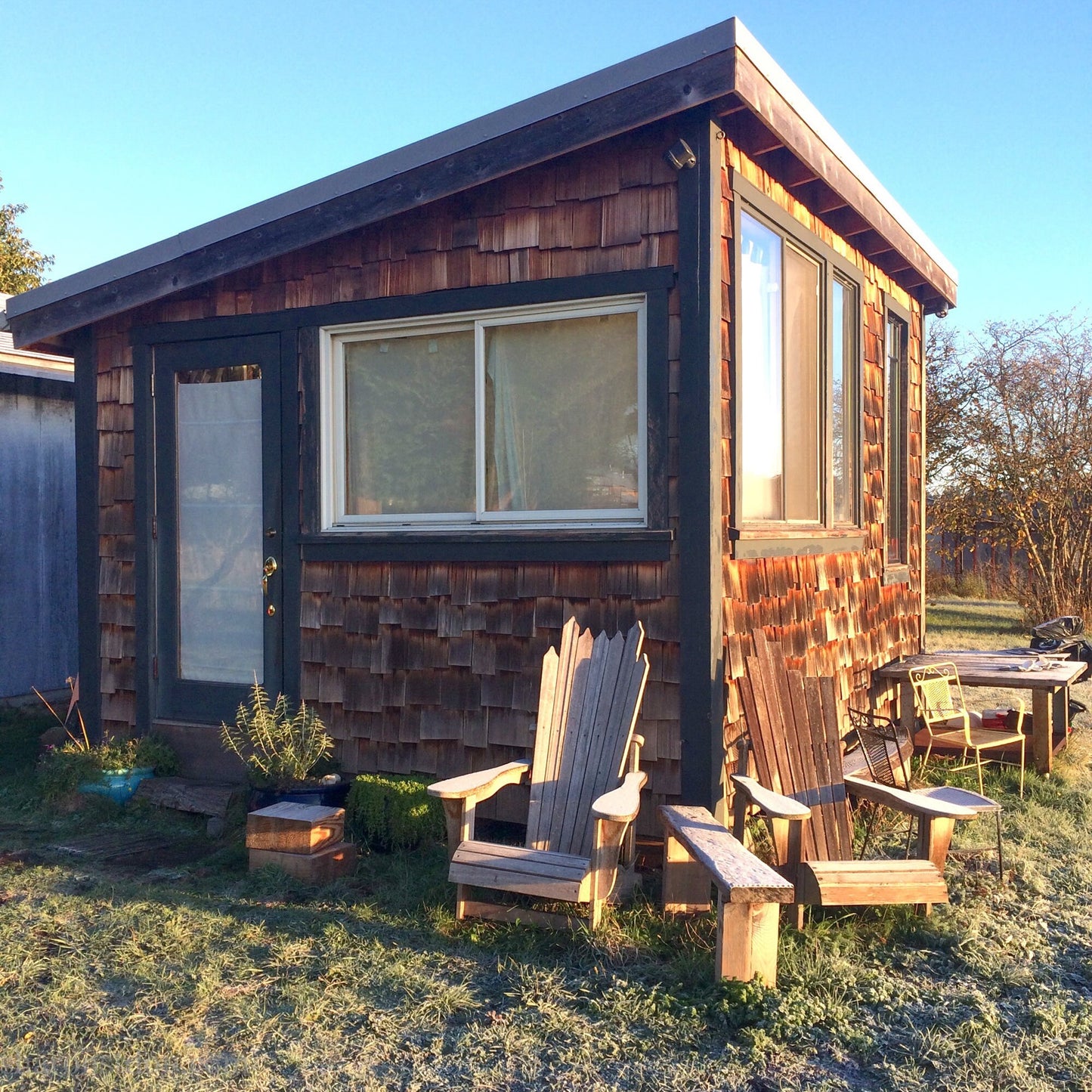 Sharon SaintDon jewelry manufacturing studio that was custom built from mostly recycled materials. Small cedar shake cabin.
