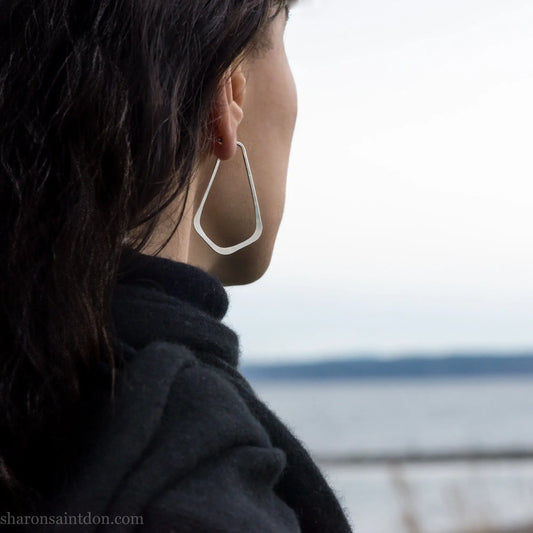 Handmade 925 sterling silver hoop earrings for women. Comfortable, lightweight, daily wear earrings with a hammered texture.