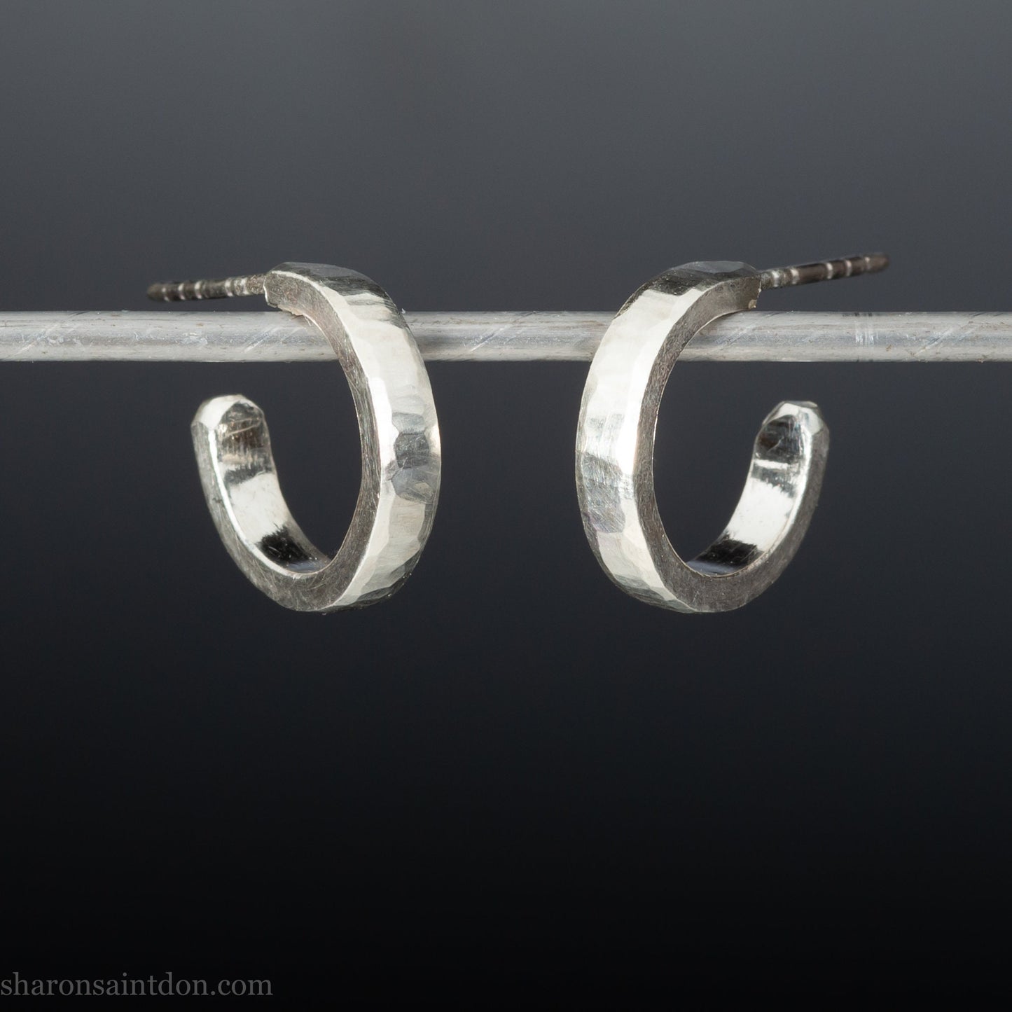 925 sterling silver hoop earrings handmade in North America by Sharon SaintDon. Small, round with hammered texture.