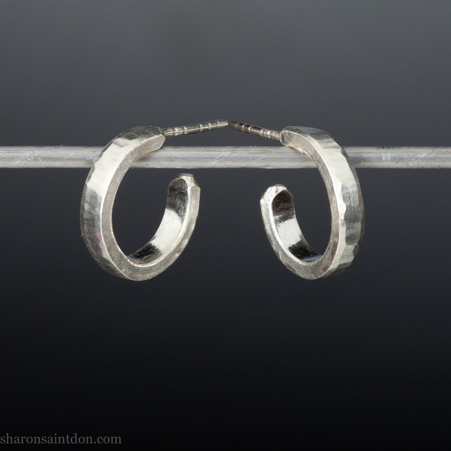 925 sterling silver hoop earrings handmade in North America by Sharon SaintDon. Small, round with hammered texture.