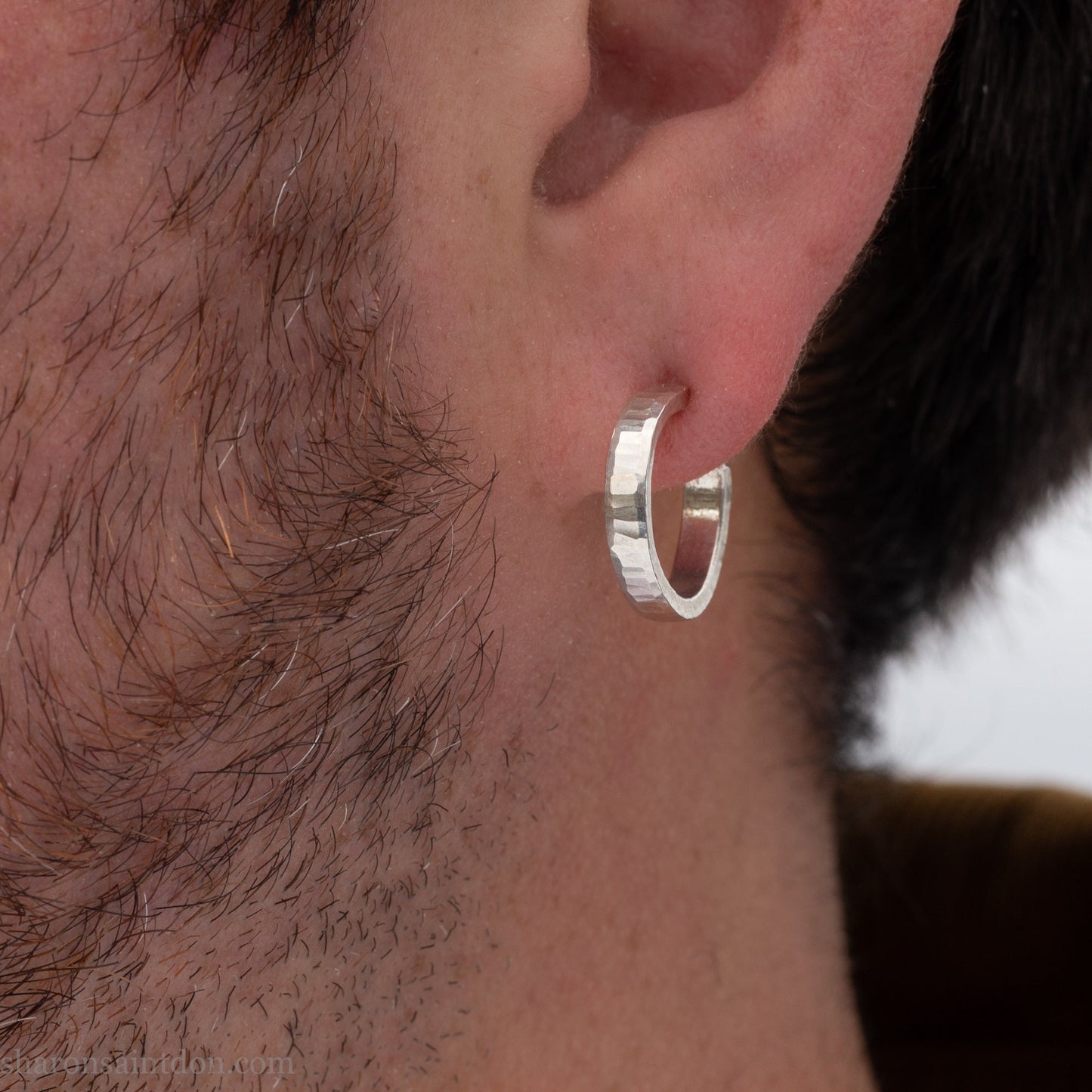 925 sterling silver hoop earrings handmade in North America by Sharon SaintDon. Small, round with hammered texture.