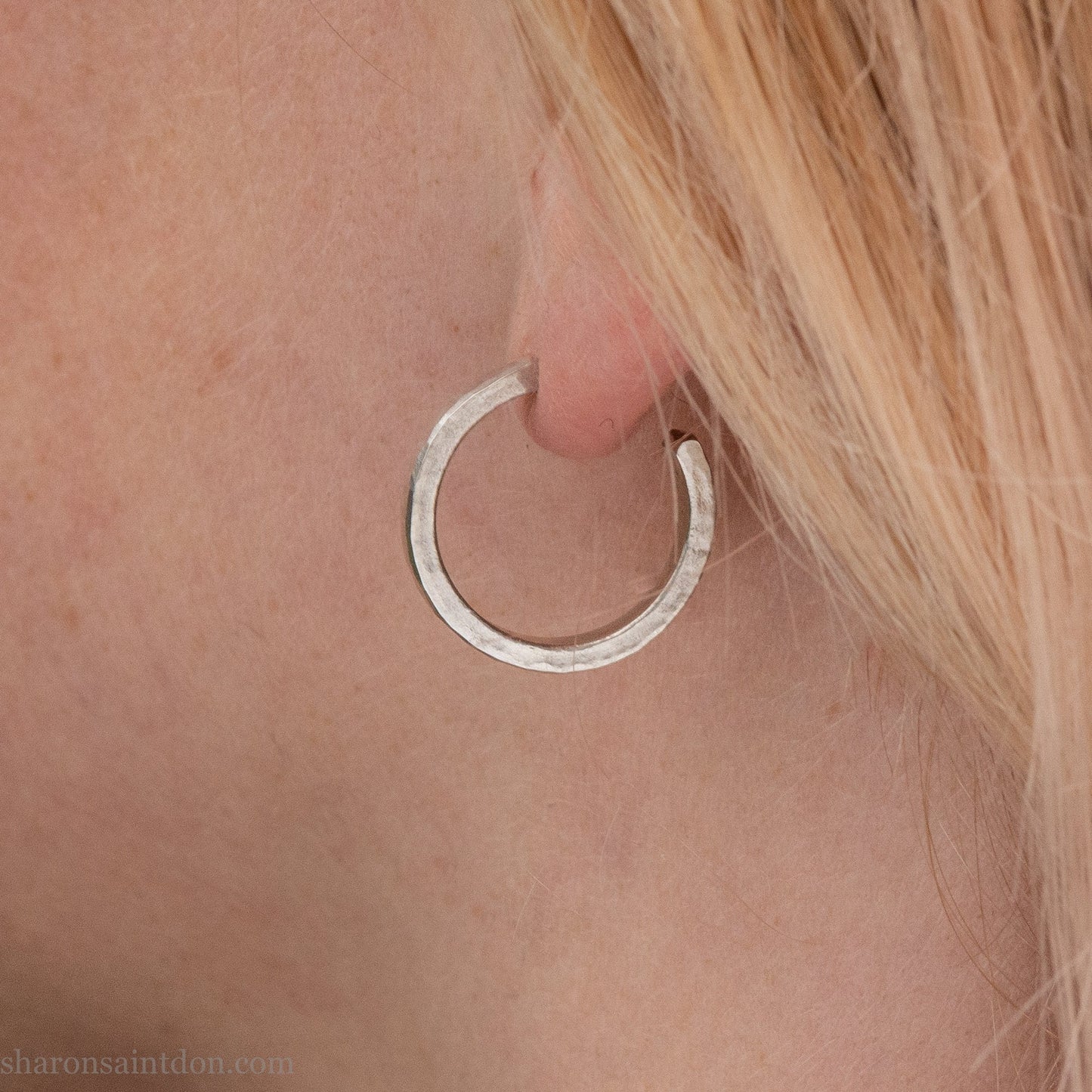 925 sterling silver hoop earrings handmade in North America by Sharon SaintDon. Small, round with hammered texture.