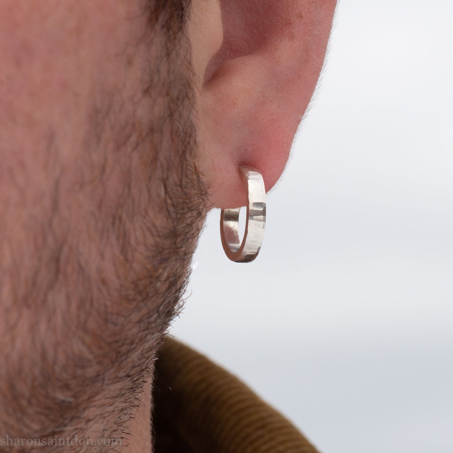 925 sterling silver hoop earrings handmade in North America by Sharon SaintDon. Small, round with hammered texture.