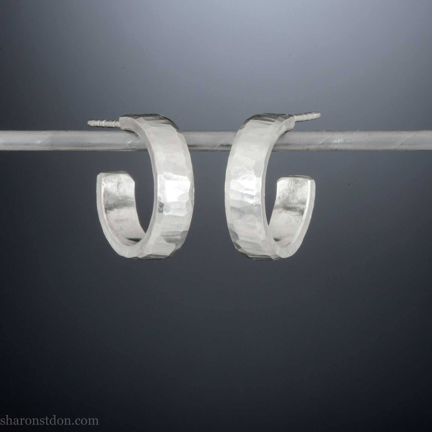 925 sterling silver hoop earrings handmade in North America by Sharon SaintDon. 16mm x 4mm, small, round with hammered texture.