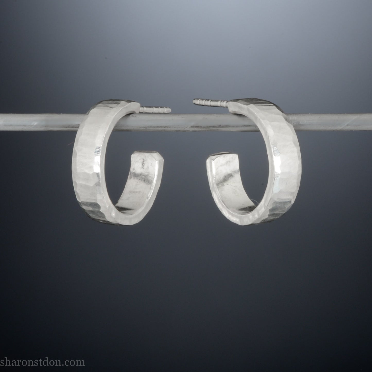 925 sterling silver hoop earrings handmade in North America by Sharon SaintDon. 16mm x 4mm, small, round with hammered texture.
