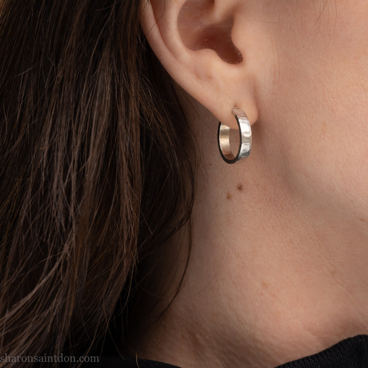 Hand hammered solid 925 sterling silver hoop earrings with a matte, brushed finish. 18mm diameter x 4mm wide x 1.5mm thick.