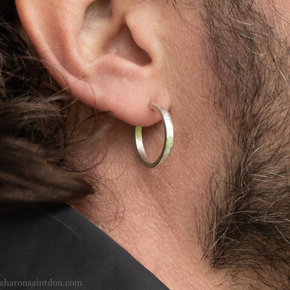 Hand hammered solid 925 sterling silver hoop earrings with a matte, brushed, finish. 20mm diameter x 2mm wide x 1.5mm thick, worn on an ear.