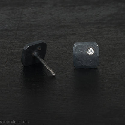 Hammered solid silver and gemstone stud earrings with a 2mm cubic zirconia set in the corner. 7 x 7mm square x 1.5mm thick silver with an oxidized black finish. Solid silver posts and backs. Handmade by Sharon SaintDon in North America.