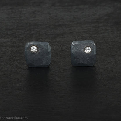 Hammered solid silver and gemstone stud earrings with a 2mm cubic zirconia set in the corner. 7 x 7mm square x 1.5mm thick silver with an oxidized black finish. Solid silver posts and backs. Handmade by Sharon SaintDon in North America.