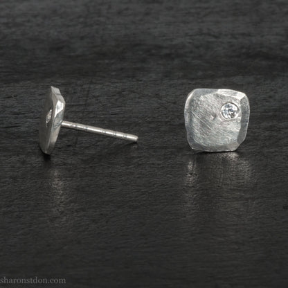 925 sterling silver stud earrings with 2mm round, imitation diamond gemstone set in the corner. 7mm square, 1.5mm thick with hammered texture, matte brushed finish, solid sterling silver posts and backs.  Handmade by Sharon SaintDon in North America.