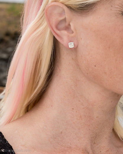 925 sterling silver stud earrings with 2mm round, imitation diamond gemstone set in the corner. 7mm square, 1.5mm thick with hammered texture, matte brushed finish, solid sterling silver posts and backs.  Handmade by Sharon SaintDon in North America.