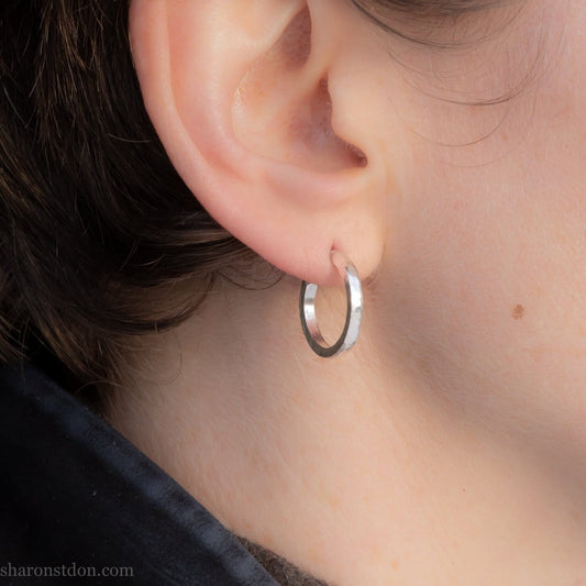 18 x 2mm handmade sterling silver hoop earrings for men or women by Sharon SaintDon. Solid, real silver hoops for every day wear with hammered texture and brushed, matte finish.