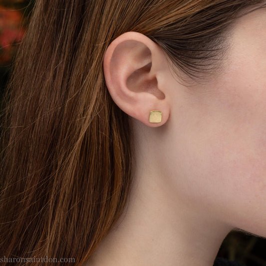 Solid 18k gold stud earrings 7mm square. Hammered with matte brushed finish, solid 18k gold backs. Handmade in the USA by Sharon Saint Don.