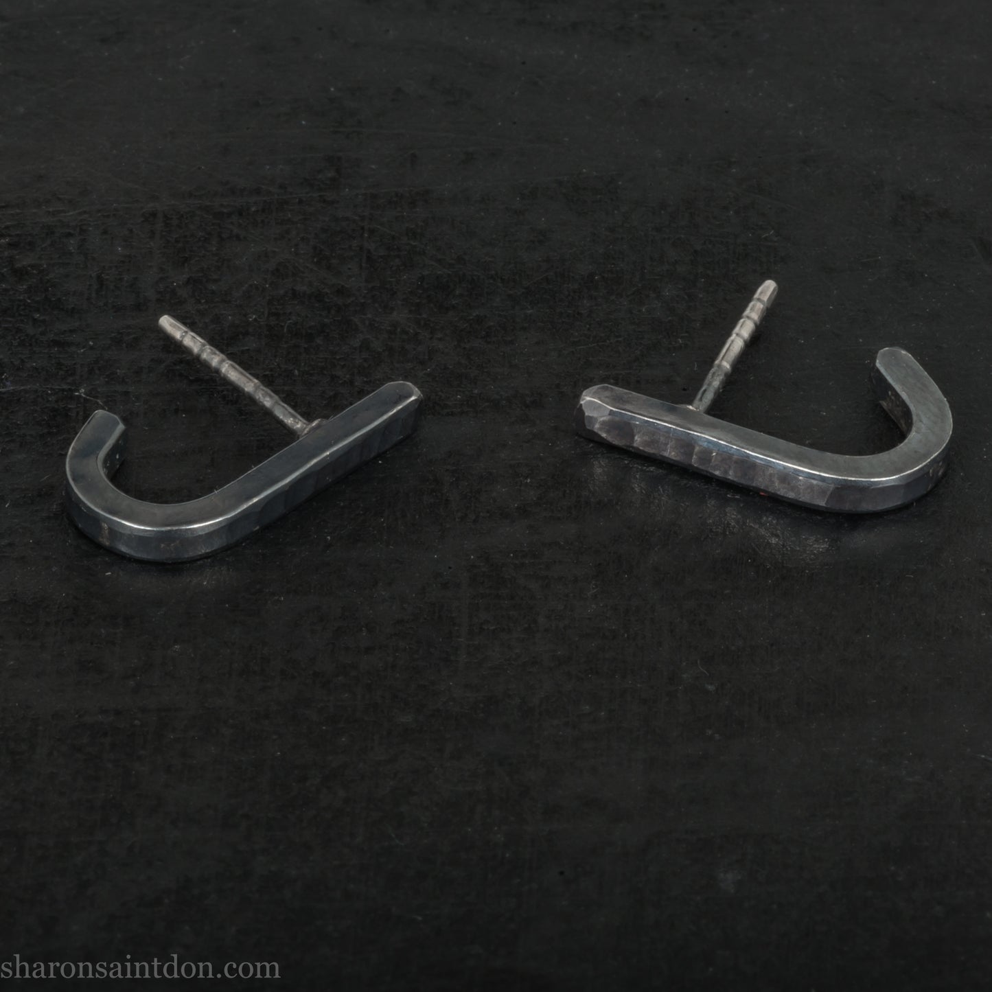 Hand hammered oxidized black sterling silver J-Curve hoop earrings, oxidized black patina.