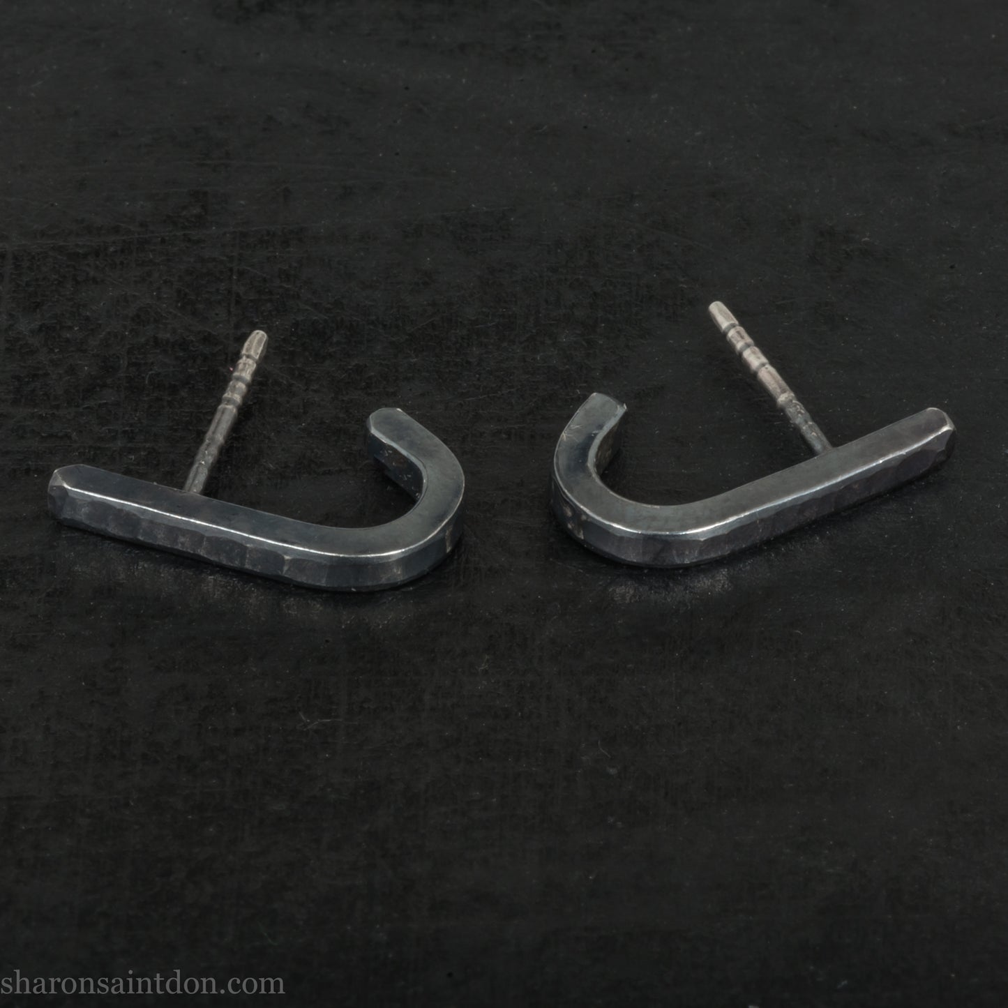 Hand hammered oxidized black sterling silver J-Curve hoop earrings, oxidized black patina.