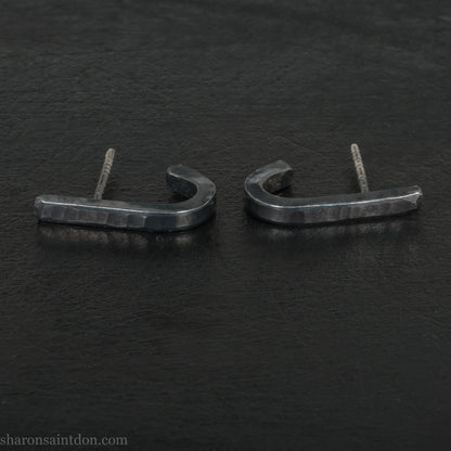 Hand hammered oxidized black sterling silver J-Curve hoop earrings, oxidized black patina.