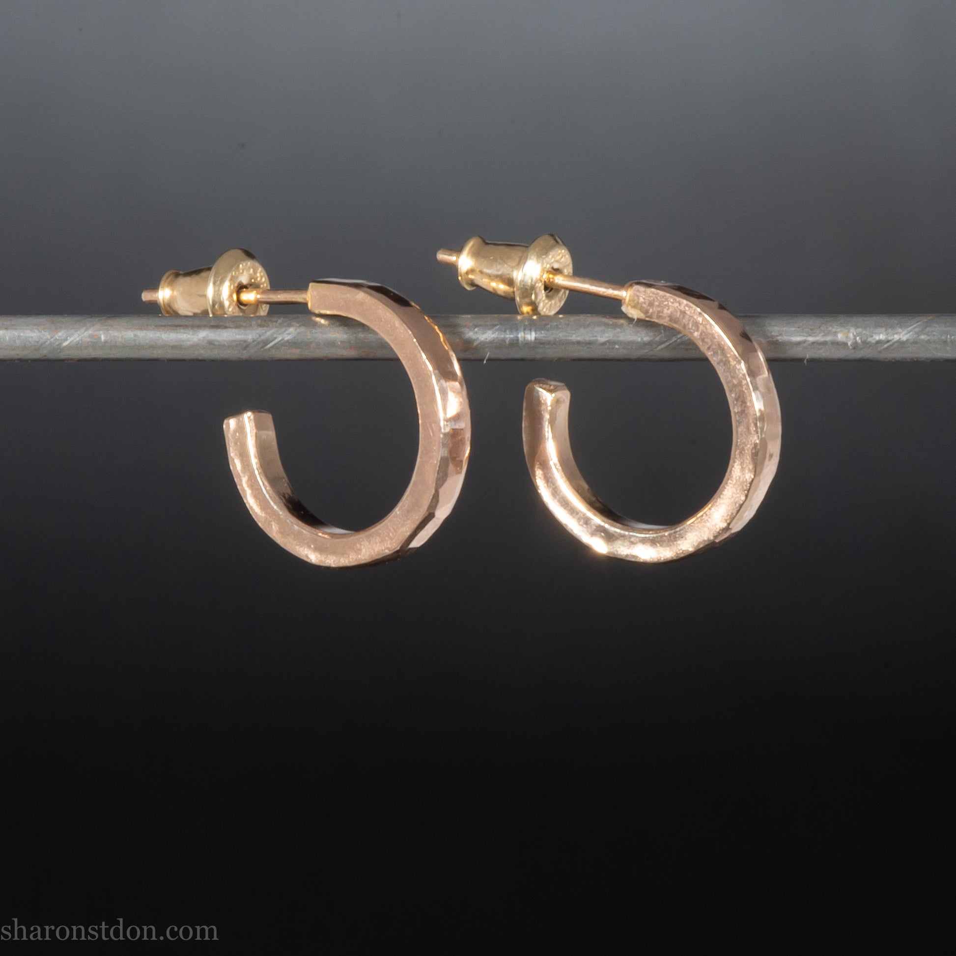 14k yellow gold hammered hoop earring, 14mm diameter, matte brushed finish, worn on ear.