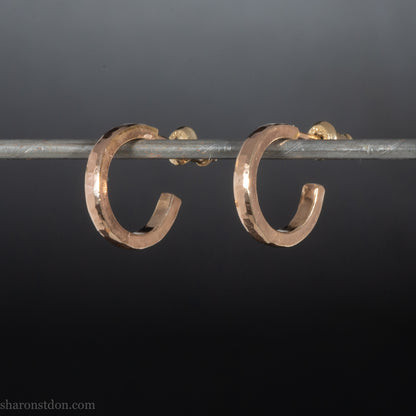 14k yellow gold hammered hoop earring, 14mm diameter, matte brushed finish, worn on ear.