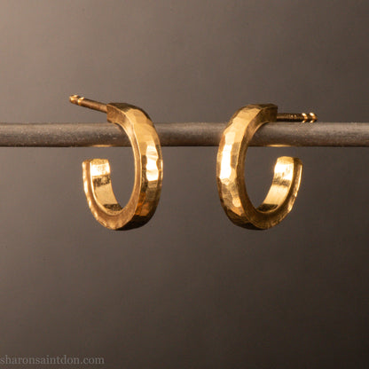 22k yellow gold hammered hoop earrings, 14mm diameter, matte brushed finish.