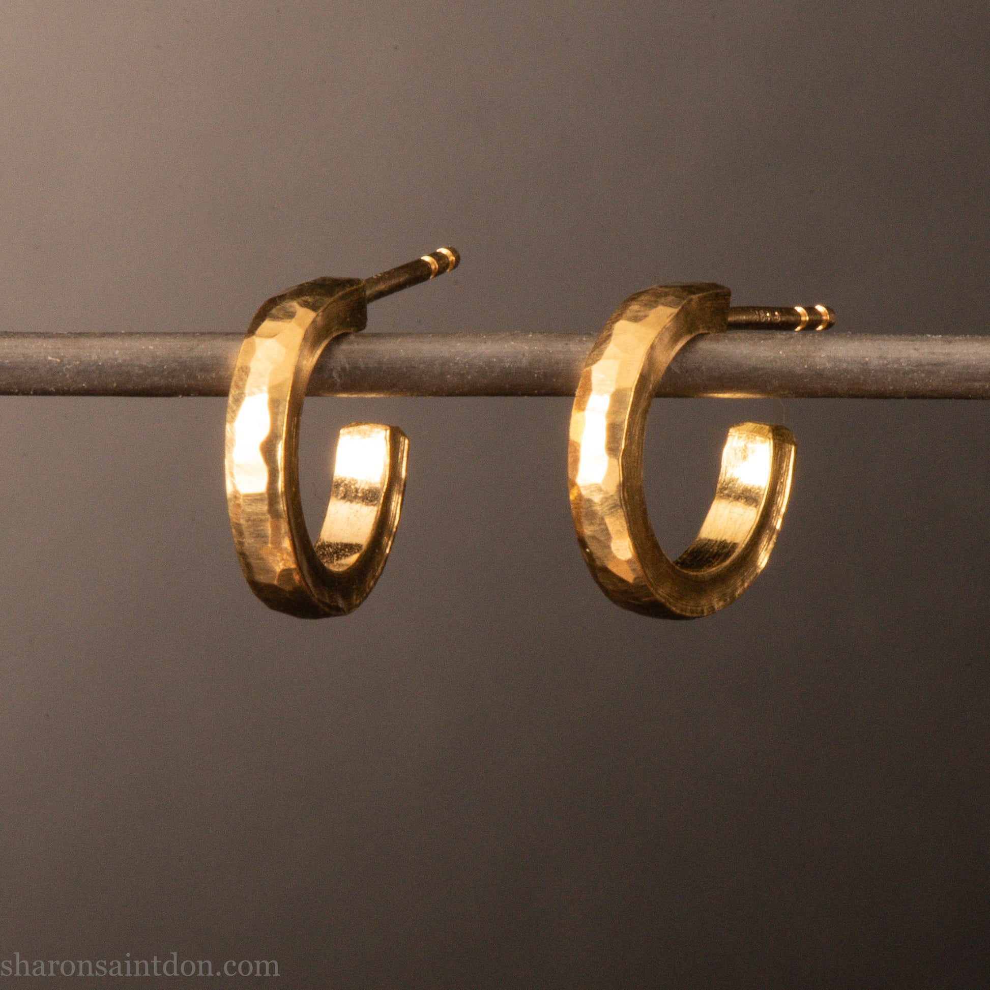 22k yellow gold hammered hoop earrings, 14mm diameter, matte brushed finish.