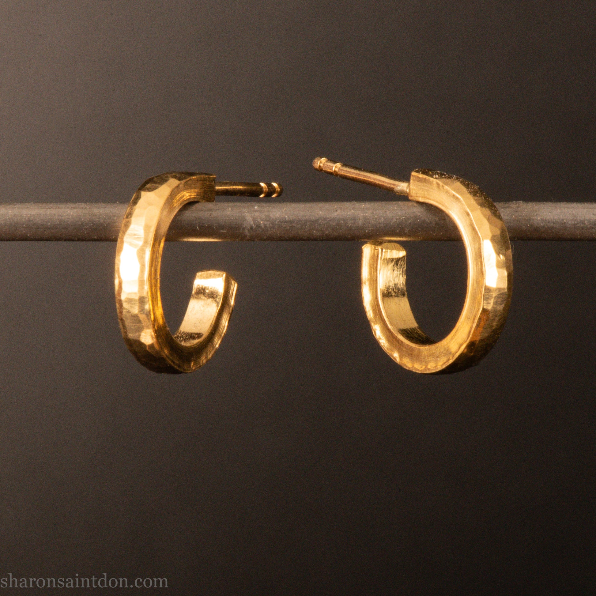 22k yellow gold hammered hoop earrings, 14mm diameter, matte brushed finish.