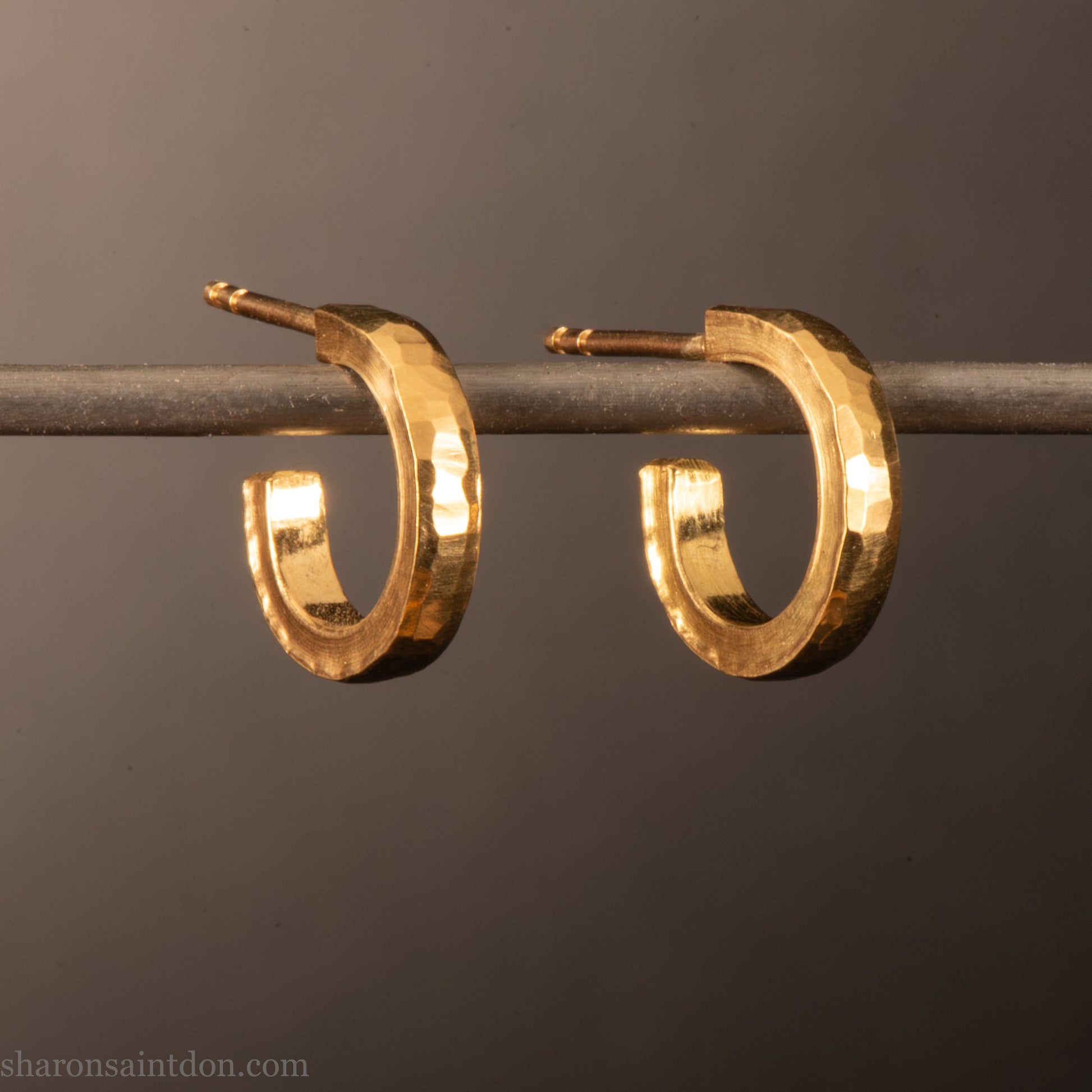 22k yellow gold hammered hoop earrings, 14mm diameter, matte brushed finish.