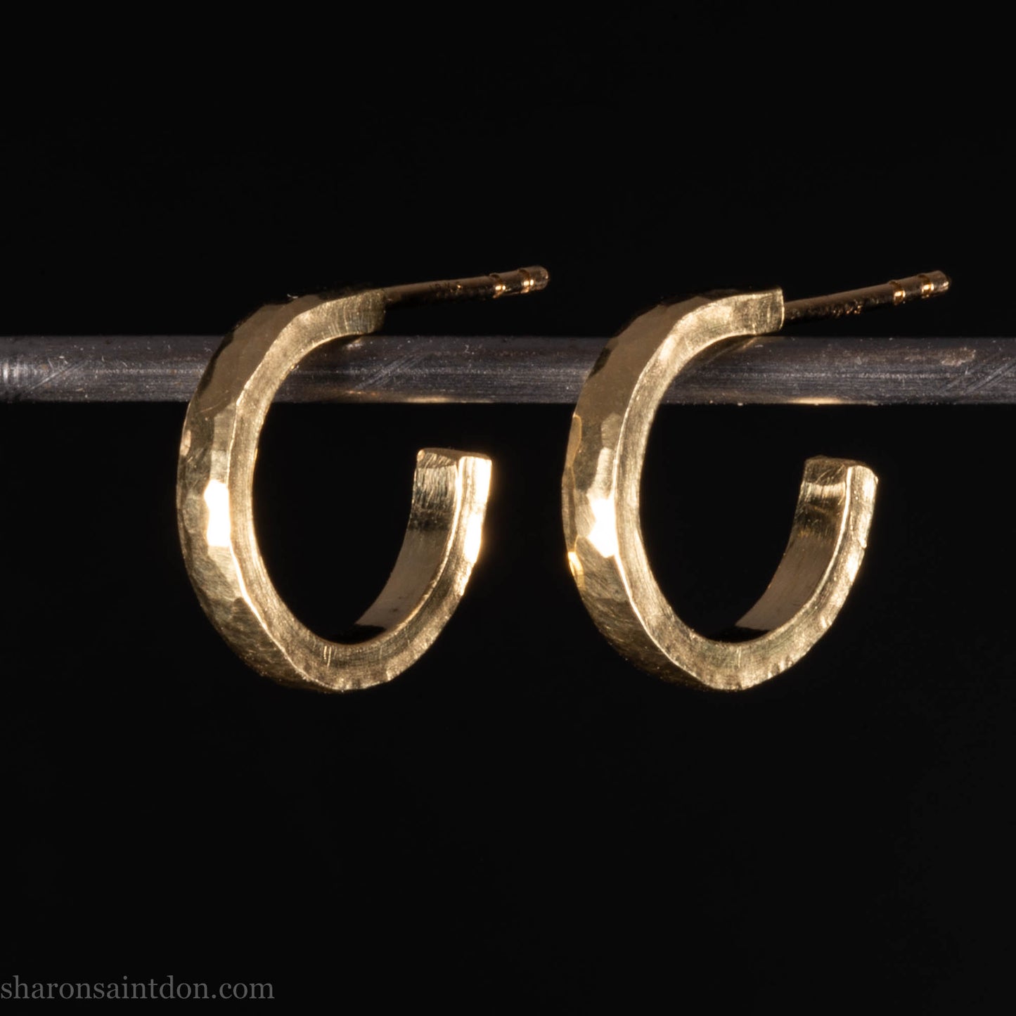 14mm solid yellow gold hoop earrings with hammered matte finish and solid gold posts, handmade by Sharon SaintDon