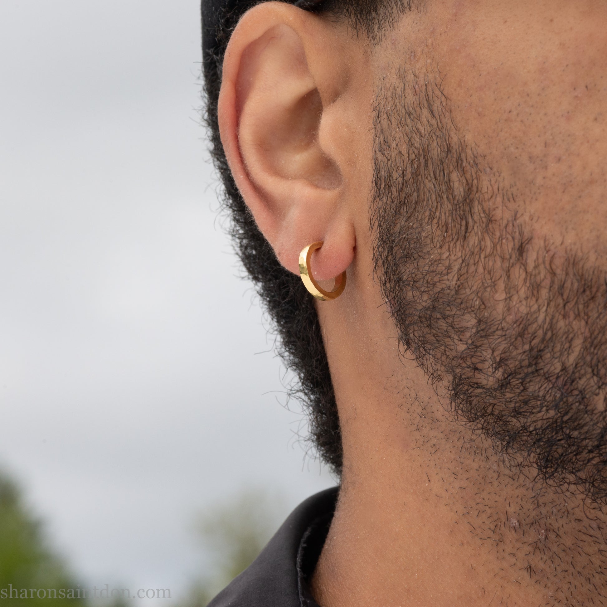 14mm solid yellow gold hoop earrings with hammered matte finish and solid gold posts, handmade by Sharon SaintDon
